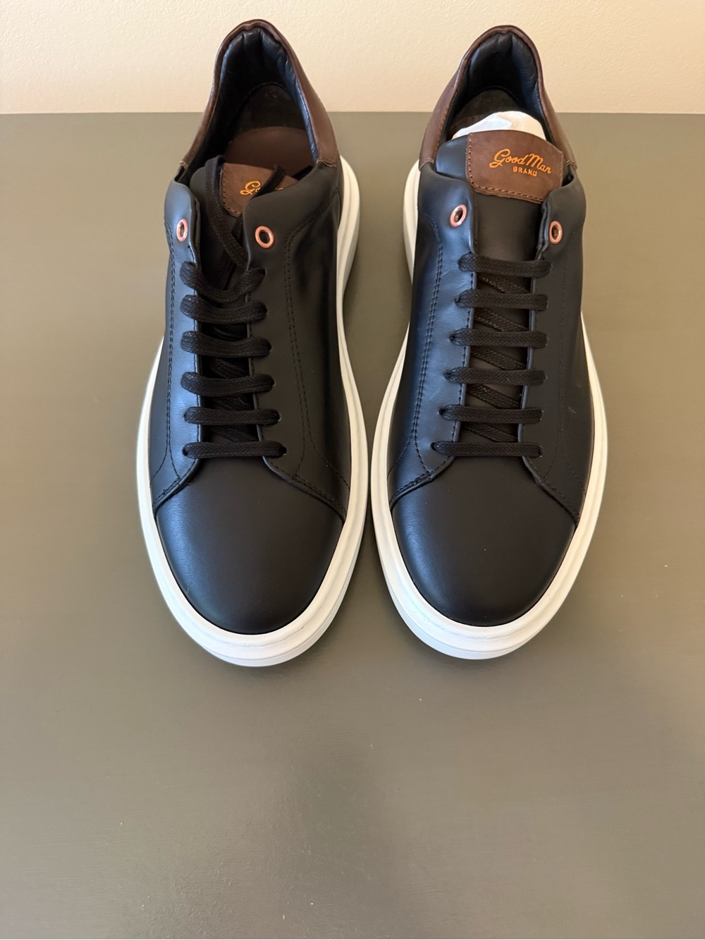 GoodMan Black Leather Low-Top Sneakers with White Sole and Brown Heel Accent